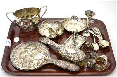 Lot 85 - A small group of silver including six teaspoons, a sugar bowl, a ring stand, a dish, napkin...