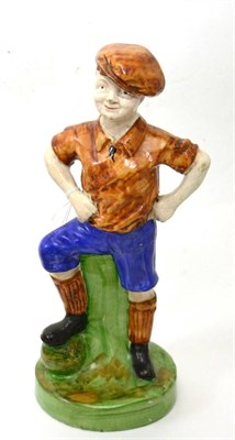 Lot 87 - Scottish pottery figure of ";Wee McGregor"; on green glazed base