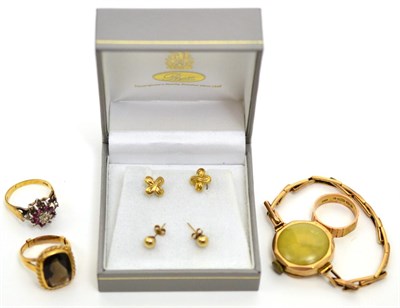Lot 147 - Three 9ct gold rings, gold cased wristwatch, stamped '375', a pair of gold ear studs, stamped '375'