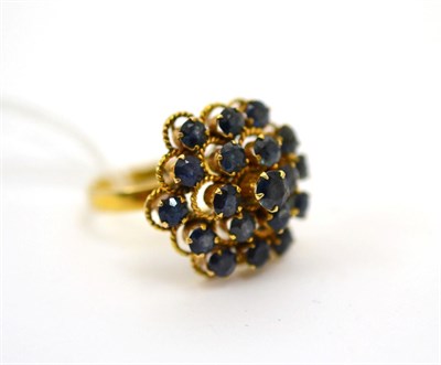 Lot 158 - A nineteen stone sapphire ring on an 18ct band