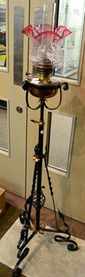 Lot 197 - An Arts & Crafts wrought iron and copper standard lamp