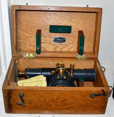 Lot 207 - A cased theodolite with tripod and measure
