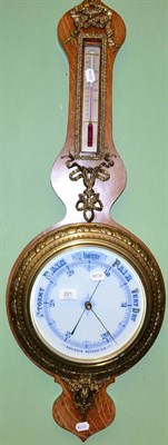 Lot 221 - A gilt metal mounted oak aneroid barometer