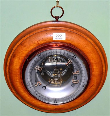 Lot 222 - An oak cased aneroid barometer