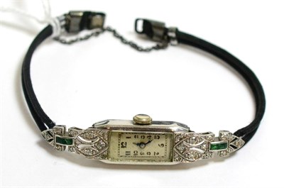 Lot 244 - A lady's diamond and emerald set wristwatch, case inscribed platinum