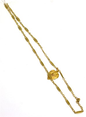 Lot 273 - A seed pearl heart locket on a fancy link chain