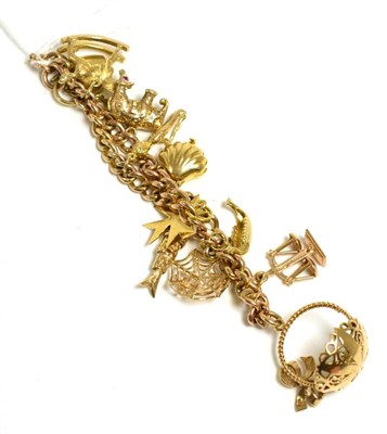 Lot 275 - A charm bracelet, with 9ct gold padlock clasp and ten charms