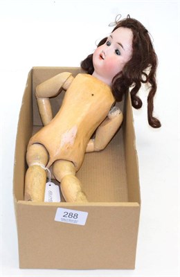 Lot 288 - Bisque socket head doll impressed '1', with sleeping blue eyes, open mouth, brown wig, on a...