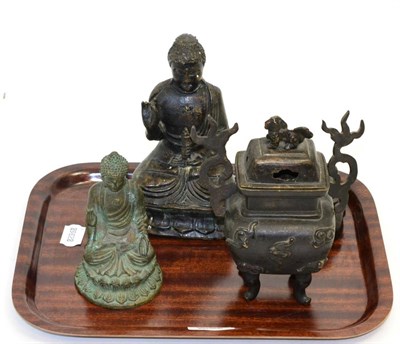 Lot 300 - Chinese bronze figure of a seated Buddha, Qing Dynasty; another smaller example; and a Chinese...