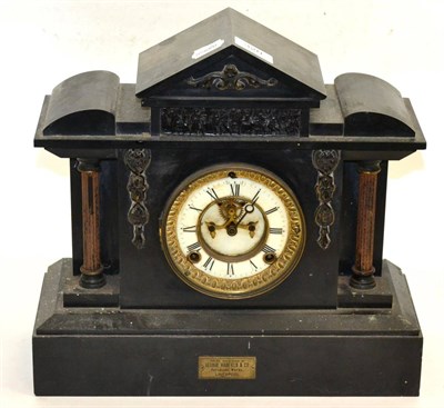 Lot 320 - A slate mantel clock of architectural form with a white enamel dial and Roman numerals