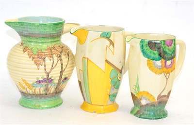 Lot 330 - Group of three Clarice Cliff Bizarre ware jugs, including a Fantasque example