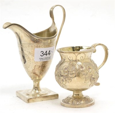 Lot 344 - A Peter & Ann Bateman helmet cream jug and a silver mug (2)
