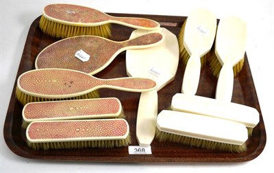 Lot 368 - Ivory backed five piece brush set and another, five piece ivory and shagreen set, both 1920's/30's