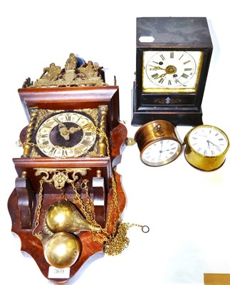 Lot 369 - An ebonised alarm timepiece clock together with a Dutch style wall clock and two small brass...