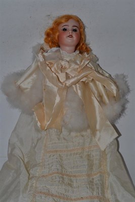 Lot 384 - A bisque head doll