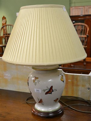 Lot 390 - A 20th century decorative pottery table lamp, painted with butterflies and with silk shade