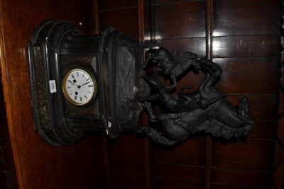 Lot 392 - A striking slate mantel clock of waisted architectural form surmounted by a spelter Marley horse