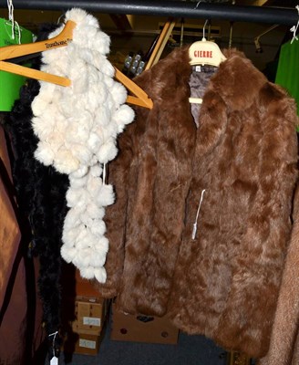 Lot 438 - A brown coney fur jacket and two 'bobble' fur stoles in black and white (3)