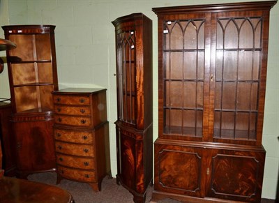 Lot 539 - Reproduction glazed bookcase, together with a reproduction standing glazed corner cupboard, an...