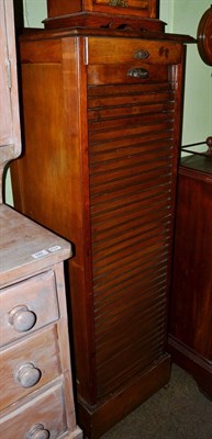 Lot 543 - A 1920's oak tambour fronted film cabinet