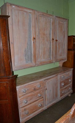 Lot 544 - Country pine dresser base with an associated hanging three door cupboard