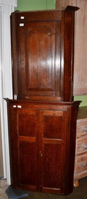 Lot 545 - George III panelled oak hanging corner cupboard together with a similar example (2)