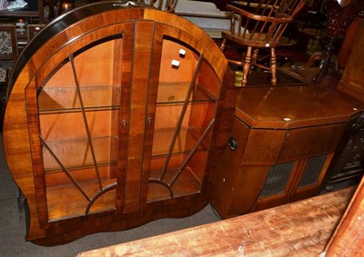 Lot 557 - A 1950's walnut veneer radiogram cabinet, together with a 1930's walnut display cabinet of...