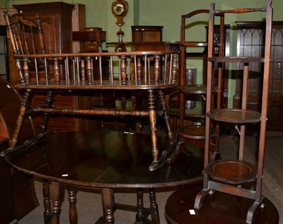 Lot 559 - An oak crib together with two oak folding cake stands