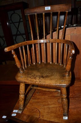 Lot 560 - A 19th century child's stick back rocking chair