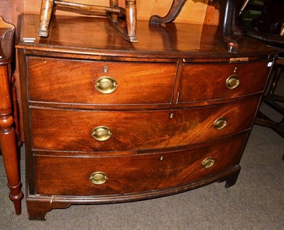 Lot 561 - A George III mahogany bow fronted three height chest of drawers