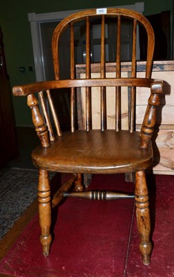 Lot 566 - A 19th century child's Windsor armchair