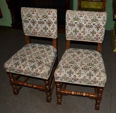 Lot 572 - A set of six oak framed dining chairs and a carver (7)