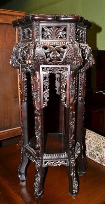 Lot 574 - A 19th century Chinese carved padouk wood marble topped jardiniere stand