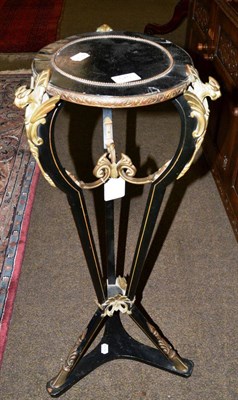 Lot 575 - An Empire style ebonised gilt metal mounted torchere with waisted triform platform base