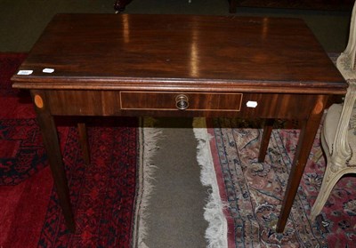 Lot 580 - A George III mahogany fold over tea table fitted one drawer