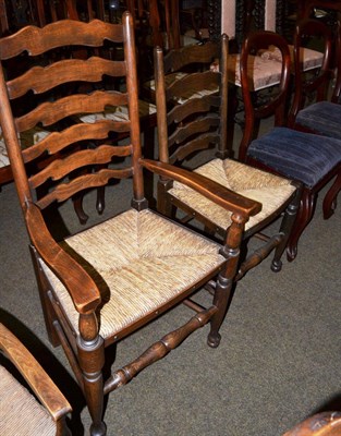 Lot 600 - Two Lancashire ladder back chairs, together with a set of three Victorian balloon back dining...