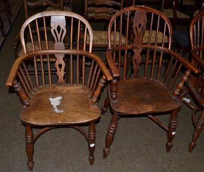 Lot 603 - An elm open Windsor armchair with crinoline stretched, together with a similar example