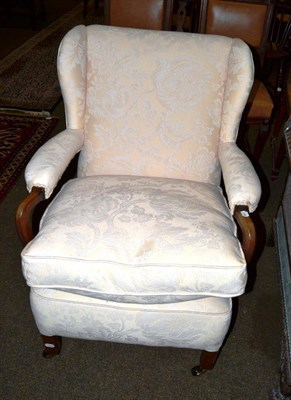 Lot 607 - An Edwardian mahogany framed armchair, later upholstered and bearing fire label