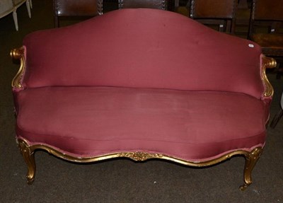 Lot 611 - A French scroll carved gilt frame two seater sofa