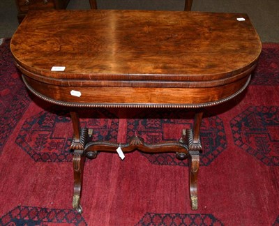 Lot 619 - A mid 19th century fold over card table