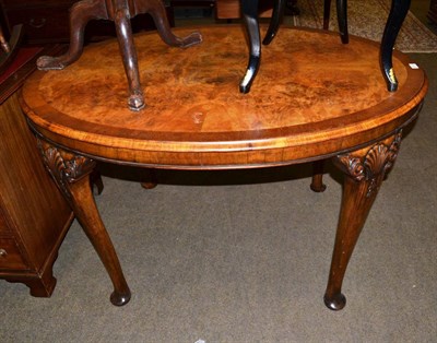 Lot 621 - A late 19th century/early 20th century walnut centre table