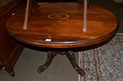 Lot 639 - A marquetry inlaid tilt top centre table