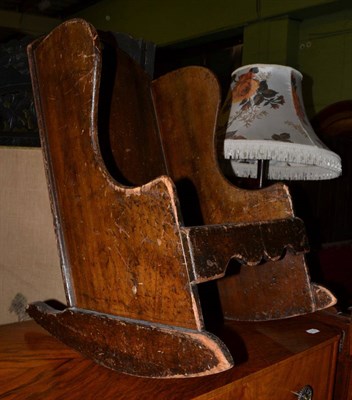 Lot 648 - An early 20th century child's rocking chair in the Arts & Crafts taste