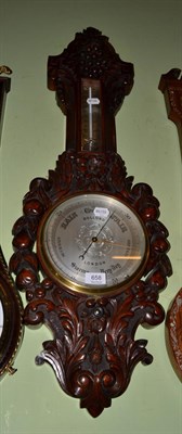 Lot 658 - Carved mahogany aneroid barometer by Dollond, London