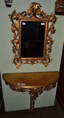 Lot 659 - A leaf carved gilt console table, together with a matching mirror