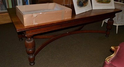 Lot 665 - A large oak refectory table with carved stretcher