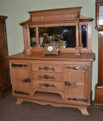 Lot 672 - An early 20th century oak mirror backed sideboard in the Arts & Crafts taste