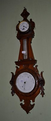 Lot 673 - A carved oak cased combined barometer/thermometer and timepiece