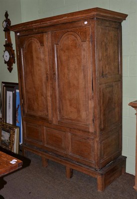 Lot 674 - An 18th century panelled country linen press