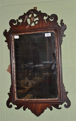 Lot 676 - A George III mahogany fret work mirror surmounted by a ho-ho bird